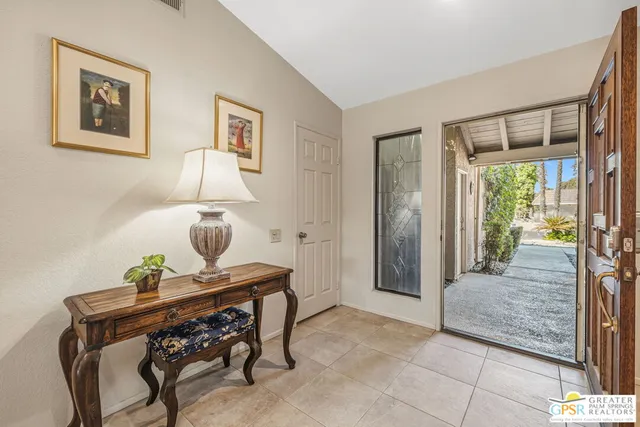 a view of room with window and bathroom