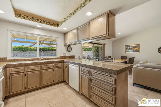 a kitchen with sink cabinets and window