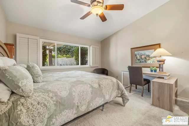 a bedroom with a bed gym equipment and a window