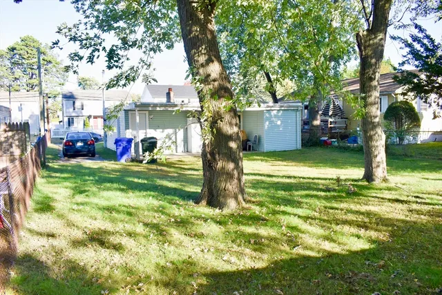 a view of a house with a yard porch and sitting area