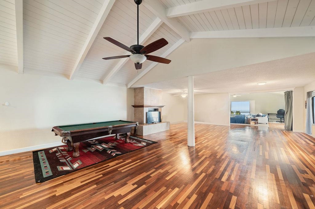 12 Upper Kimo Drive Kula, HI 96790 - Photo 13 of 30 a bedroom with furniture and a wooden floor