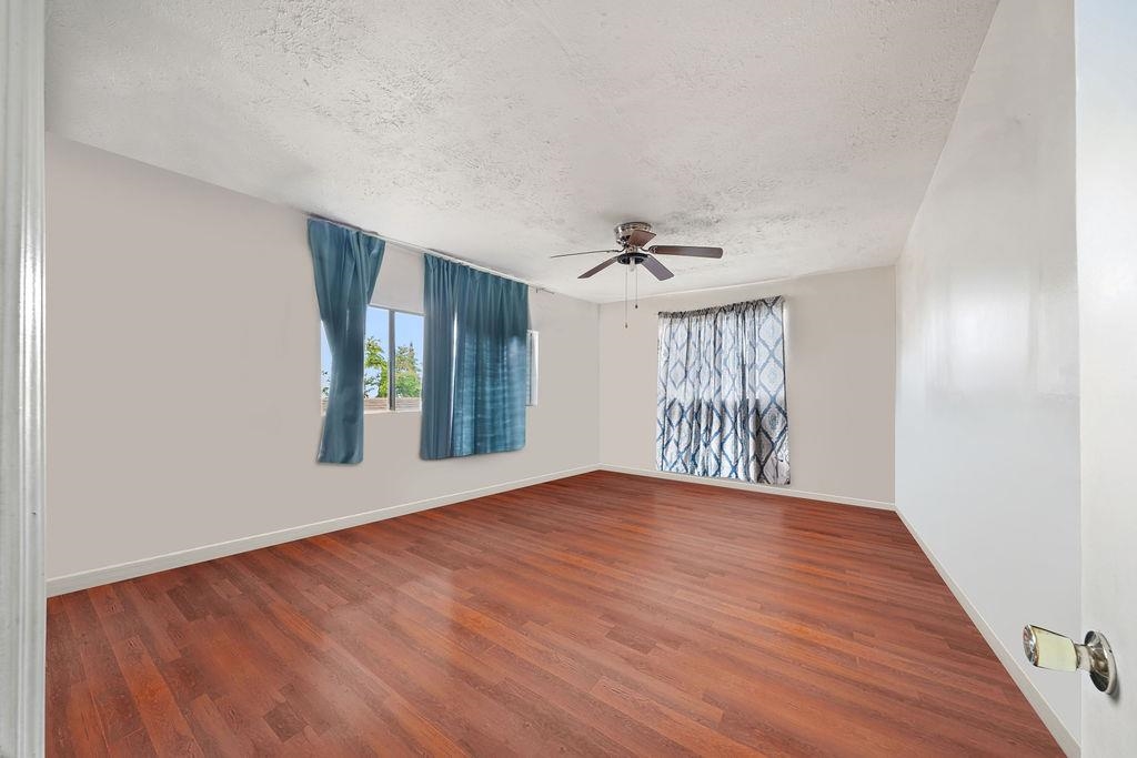 12 Upper Kimo Drive Kula, HI 96790 - Photo 16 of 30 a view of an empty room with window and wooden floor