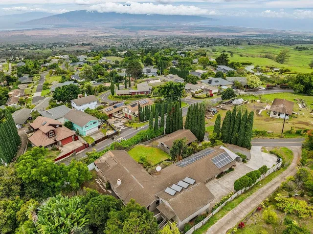 an aerial view of residential house with outdoor space