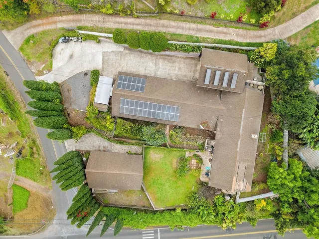 an aerial view of a house with outdoor space
