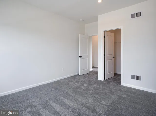 a room with a sink and a mirror