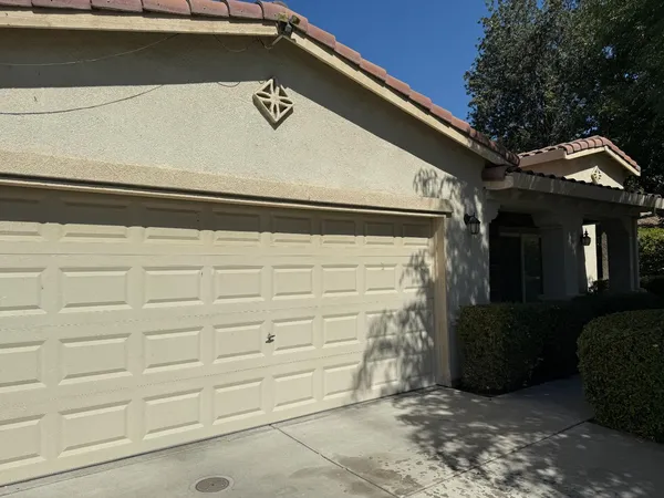 a view of a kitchen with a sink cabinets and stainless steel appliances
