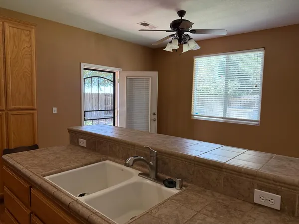 a kitchen with a refrigerator and a stove