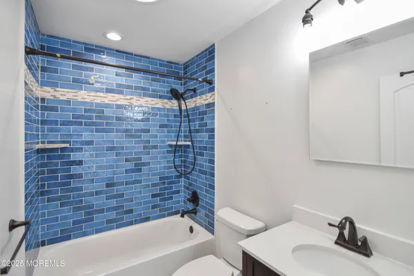 a bathroom with a sink and a bathtub