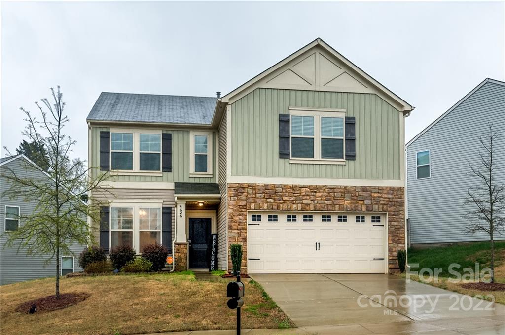 4626 Gibbons Link Road Charlotte, NC 28269 - Photo 1 of 20 a front view of a house with a yard