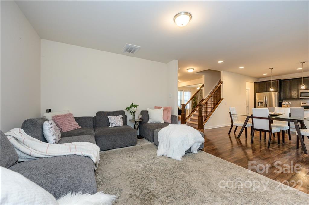 4626 Gibbons Link Road Charlotte, NC 28269 - Photo 11 of 20 a living room with furniture and stairs