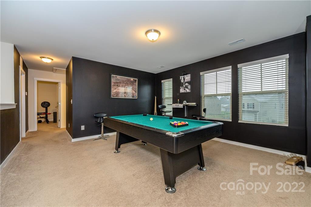 4626 Gibbons Link Road Charlotte, NC 28269 - Photo 13 of 20 a room with pool table and windows