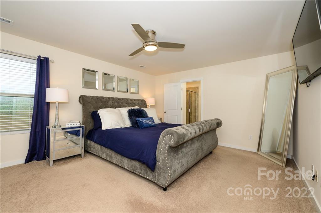 4626 Gibbons Link Road Charlotte, NC 28269 - Photo 14 of 20 a living room with a bed furniture and a window