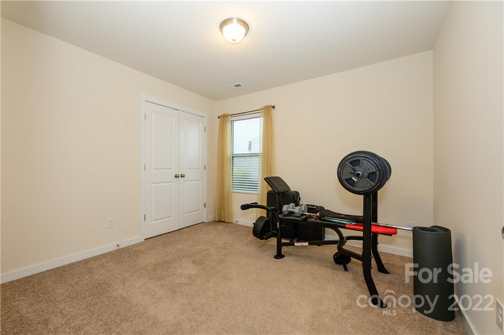 4626 Gibbons Link Road Charlotte, NC 28269 - Photo 19 of 20 a view of a room with gym equipment