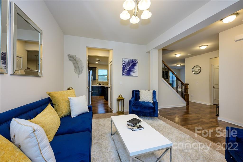 4626 Gibbons Link Road Charlotte, NC 28269 - Photo 2 of 20 a living room with furniture and wooden floor