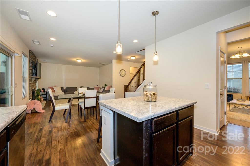 4626 Gibbons Link Road Charlotte, NC 28269 - Photo 7 of 20 a kitchen with a table chairs sink and wooden floor
