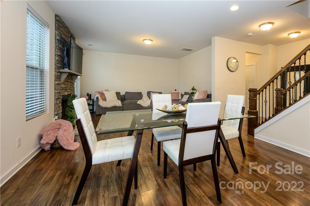 4626 Gibbons Link Road Charlotte, NC 28269 - Photo 8 of 20 a dining room with furniture and wooden floor