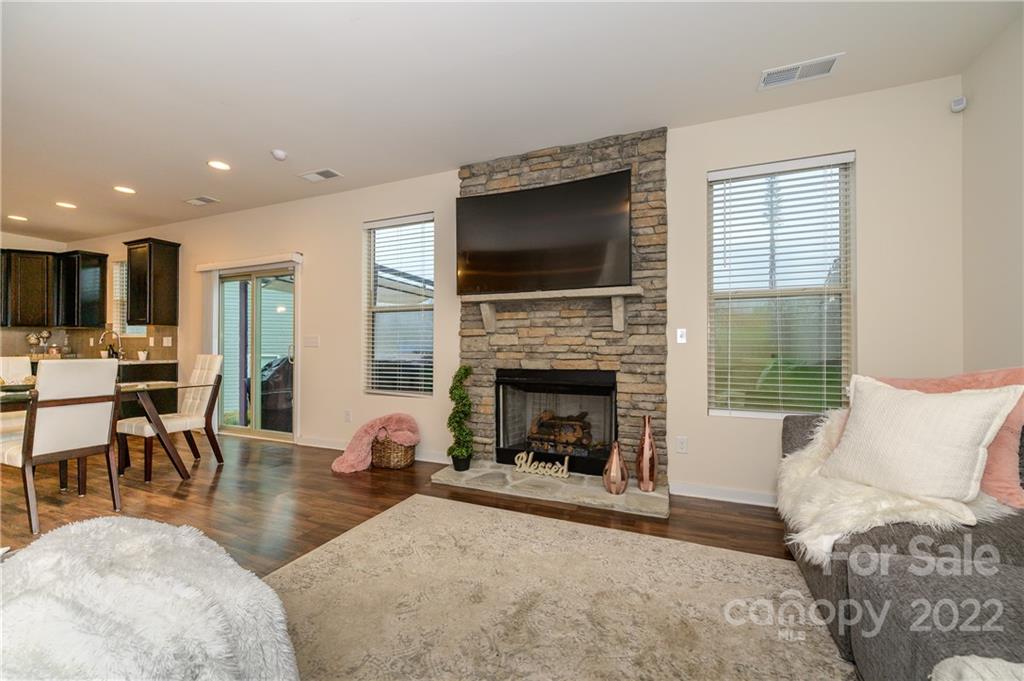 4626 Gibbons Link Road Charlotte, NC 28269 - Photo 10 of 20 a living room with furniture fireplace and flat screen tv