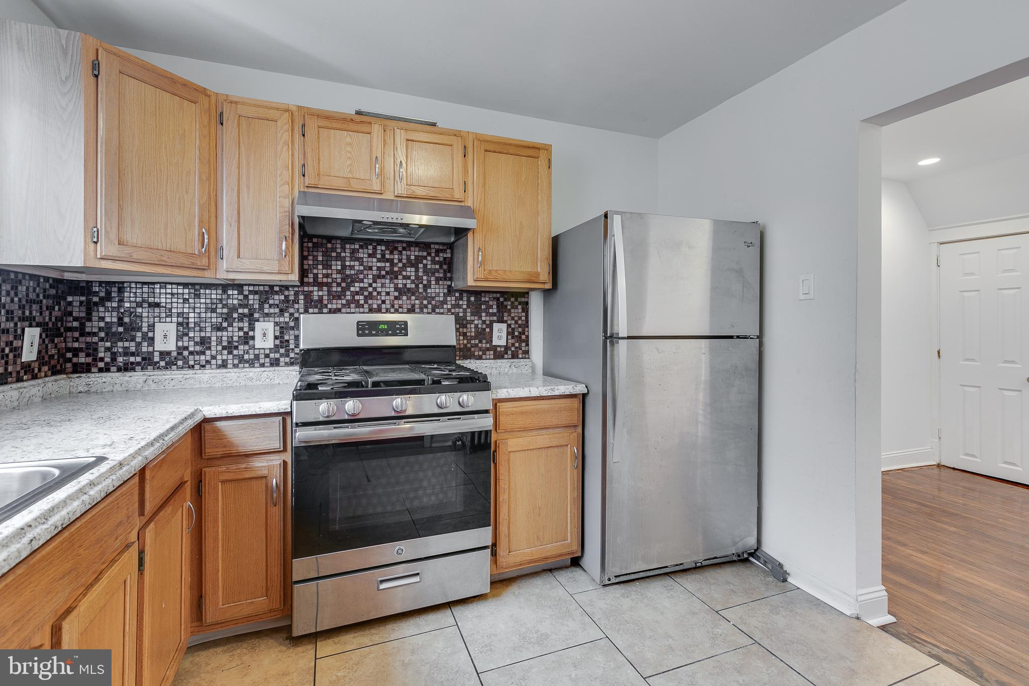 7811 Temple Road Philadelphia, PA 19150 - Photo 14 of 35 Tile floors and newer stainless steel appliances