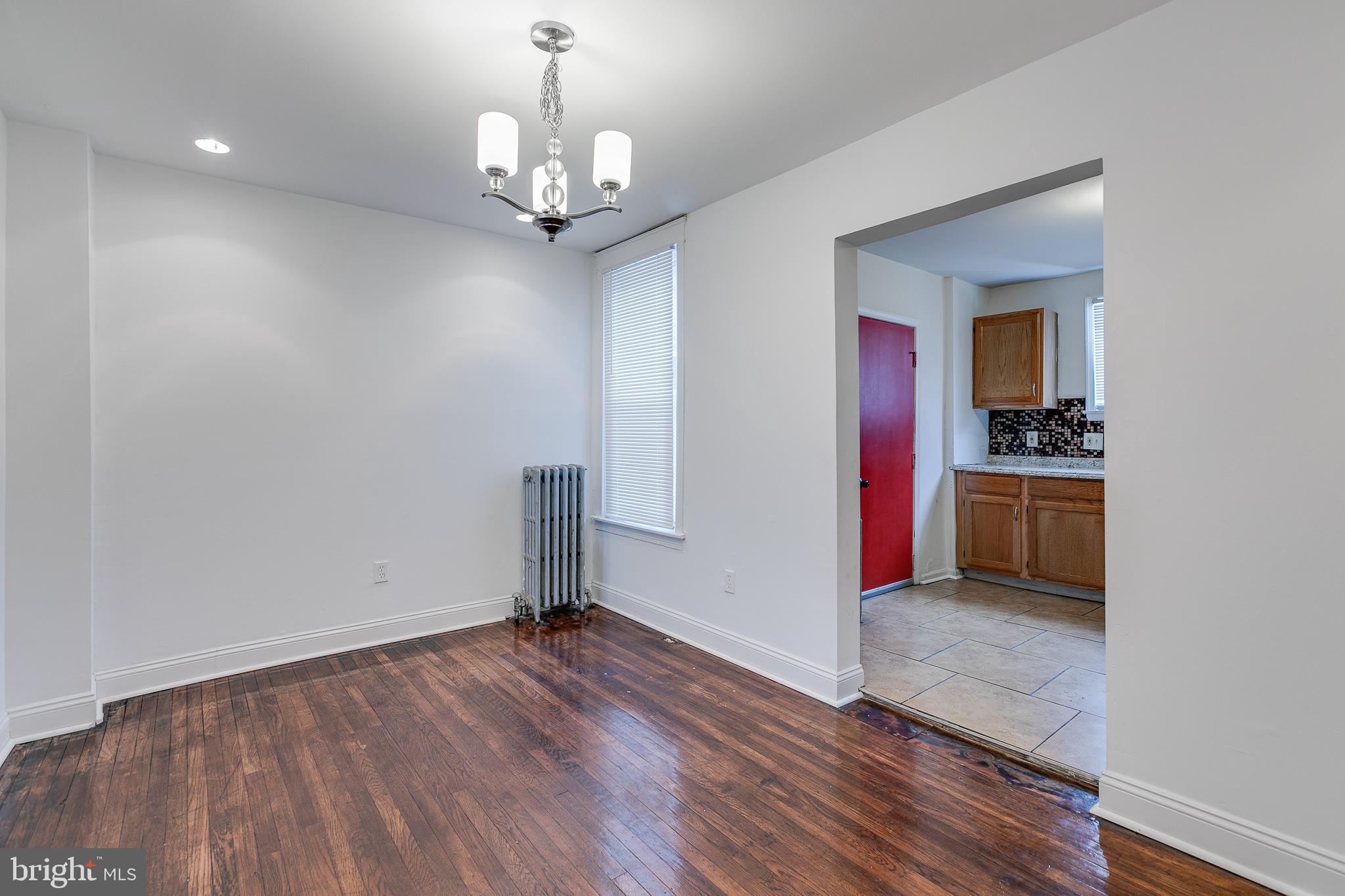 7811 Temple Road Philadelphia, PA 19150 - Photo 10 of 35 Wide opening to kitchen with access to balcony