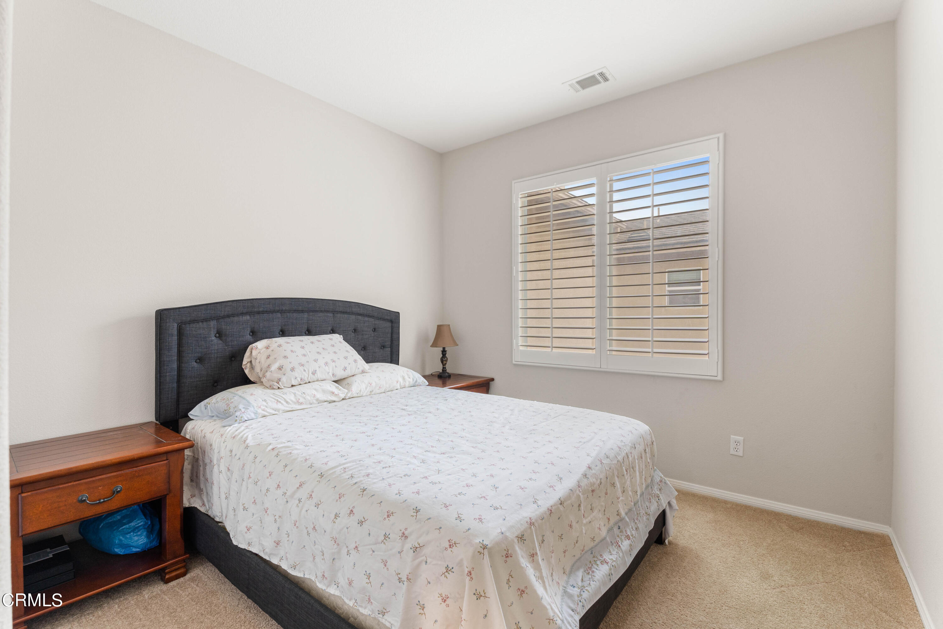 1620 Rubio Circle Oxnard, CA 93030 - Photo 24 of 68 a bedroom with a bed and a window