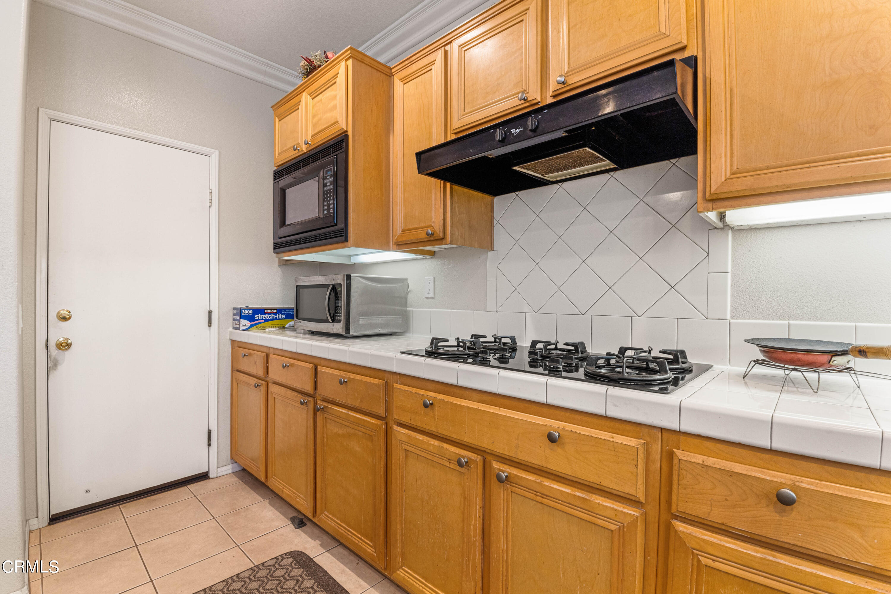 1620 Rubio Circle Oxnard, CA 93030 - Photo 40 of 68 a kitchen with stainless steel appliances a sink a stove and cabinets