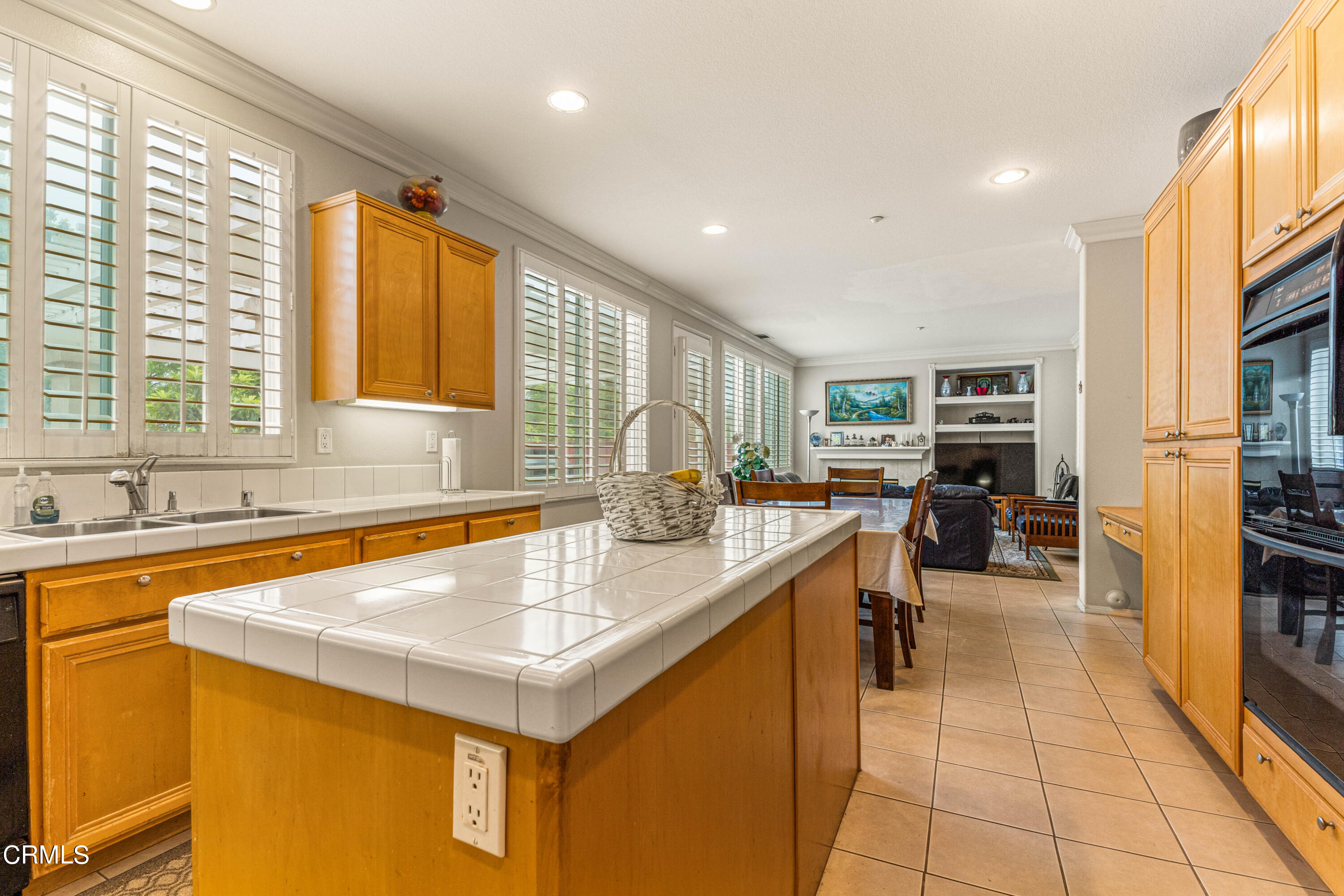 1620 Rubio Circle Oxnard, CA 93030 - Photo 42 of 68 a kitchen with a sink a counter top space and stainless steel appliances