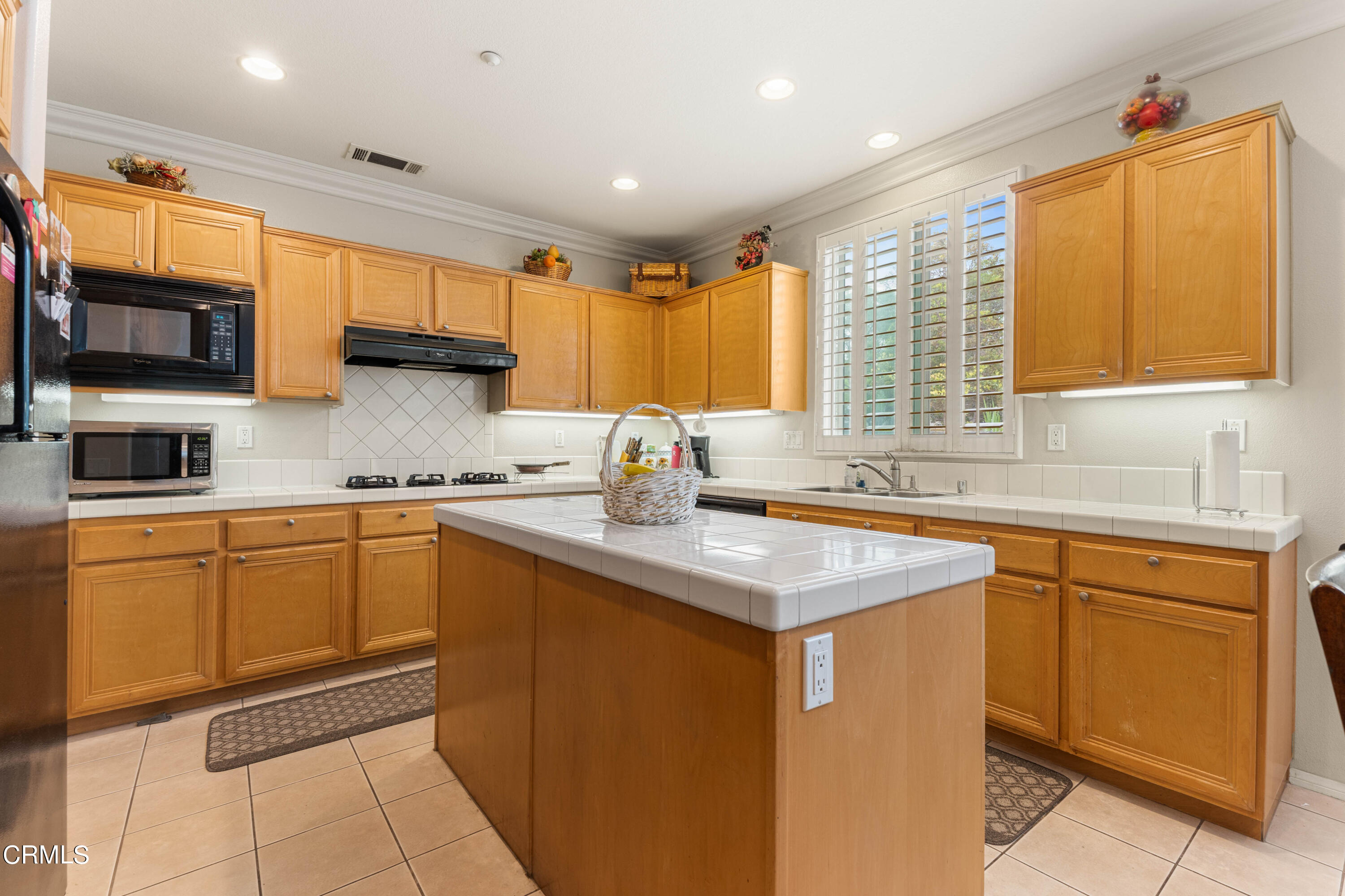 1620 Rubio Circle Oxnard, CA 93030 - Photo 44 of 68 a kitchen with stainless steel appliances granite countertop a sink stove and cabinets