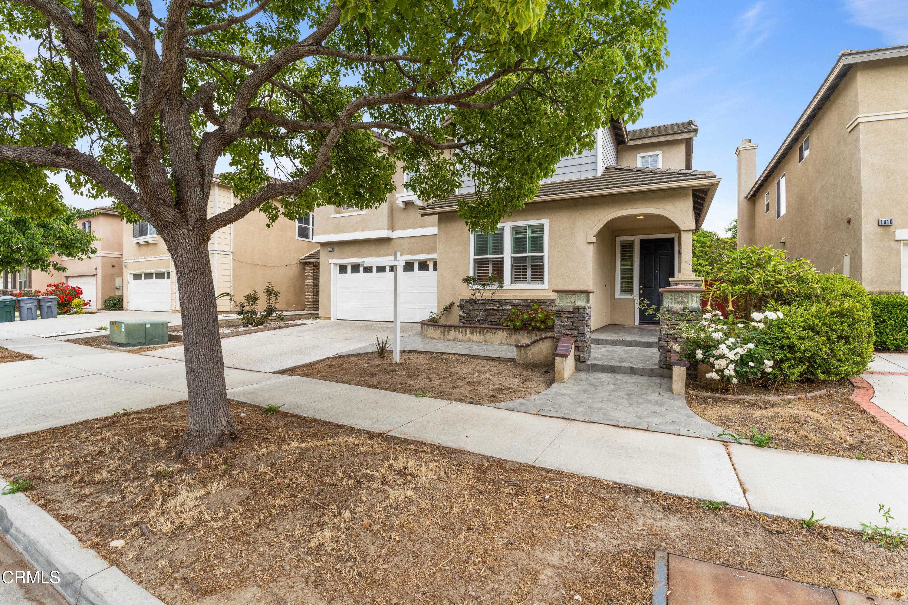 1620 Rubio Circle Oxnard, CA 93030 - Photo 5 of 68 a front view of a house with a yard and garage