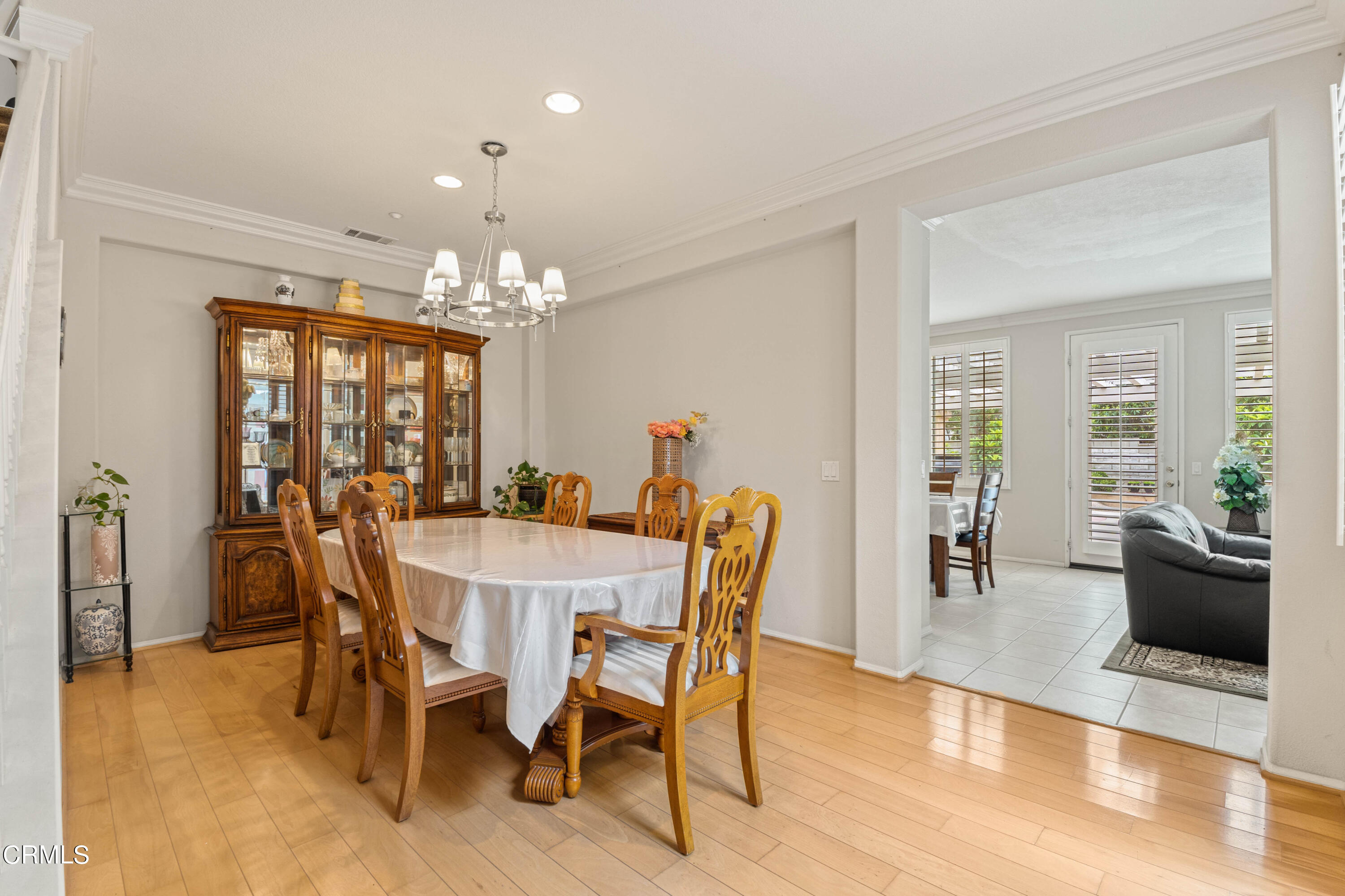 1620 Rubio Circle Oxnard, CA 93030 - Photo 53 of 68 a dining room with furniture a chandelier and wooden floor