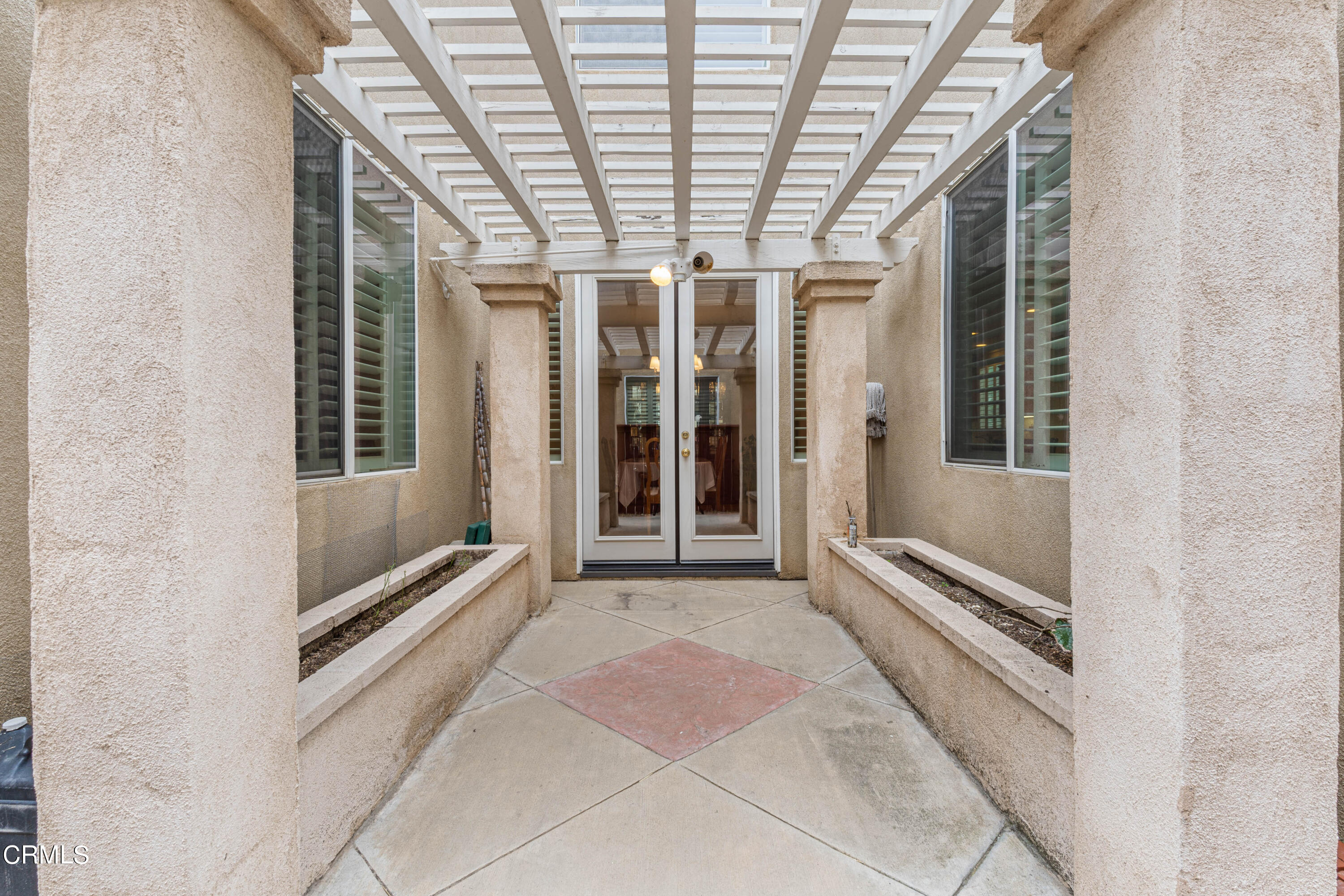1620 Rubio Circle Oxnard, CA 93030 - Photo 64 of 68 a view of an entryway with a floor to ceiling window