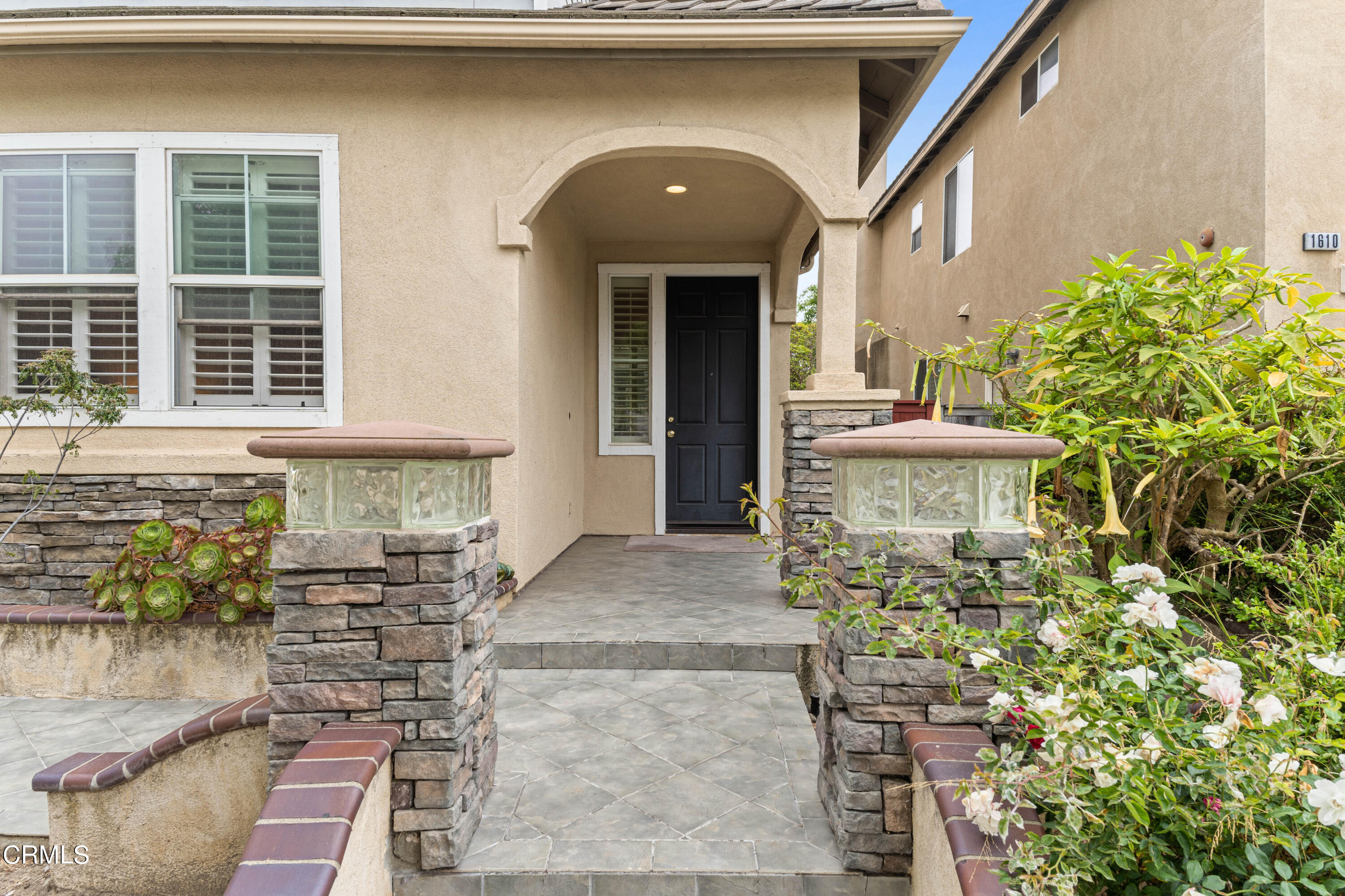 1620 Rubio Circle Oxnard, CA 93030 - Photo 9 of 68 a front view of a house with a garden