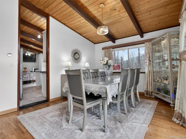 a dining room with furniture and window