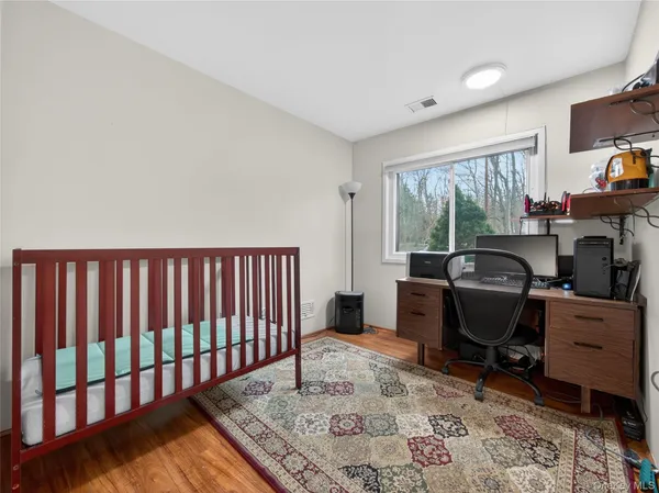 a workspace with furniture and a window