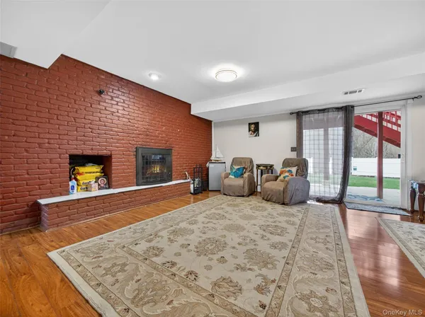 a bed room with furniture window and wooden floor