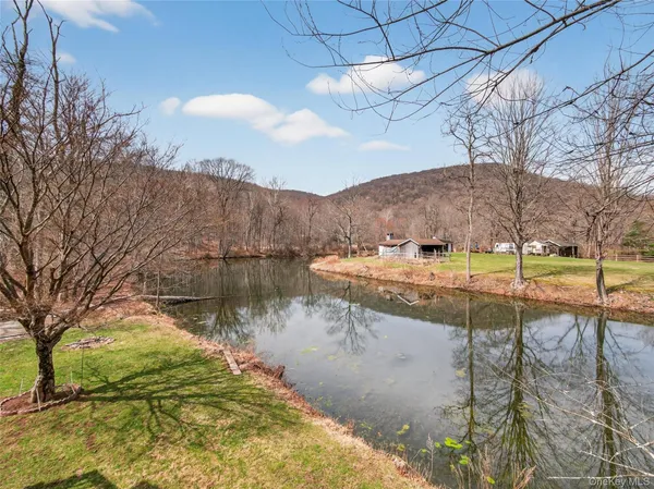 a view of a lake in middle of the house