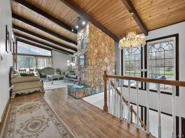 a living room with furniture windows and a dining table