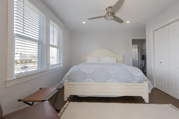 a bedroom with a bed and window
