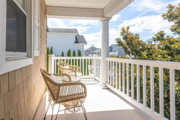 a view of a chair and table in the balcony