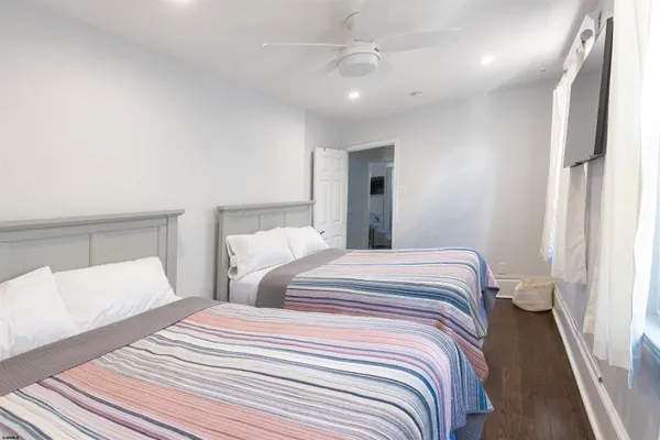 a bedroom with a bed and a lamp