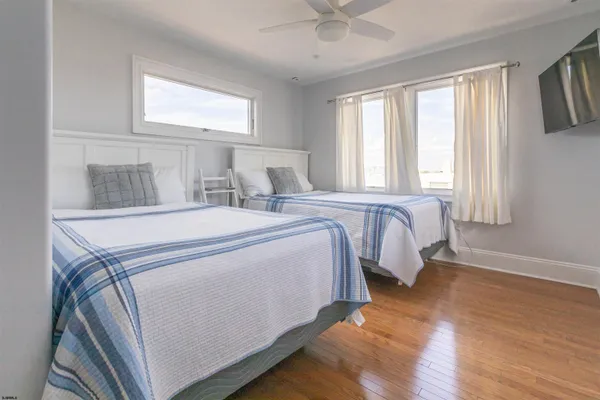 a bed room with a bed and a window