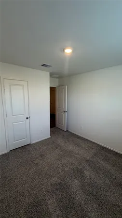 a view of an empty room and natural light