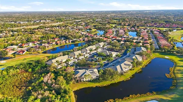 an aerial view of residential houses with outdoor space