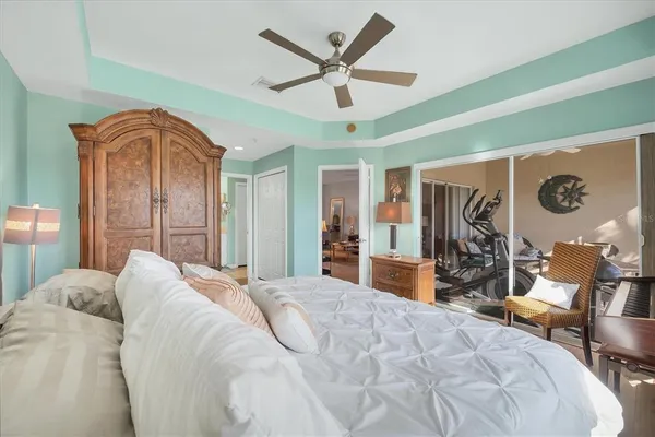 a bedroom with a bed and a desk