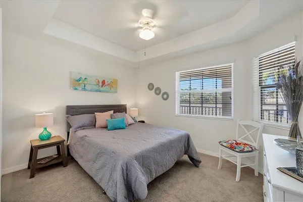 a bedroom with a bed and a table