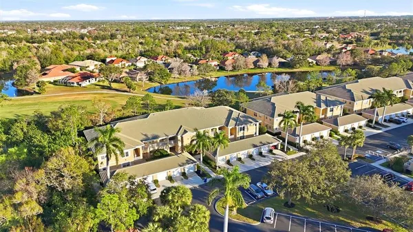 an aerial view of residential houses with outdoor space