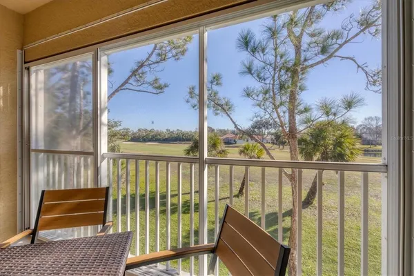 a view of a balcony with furniture