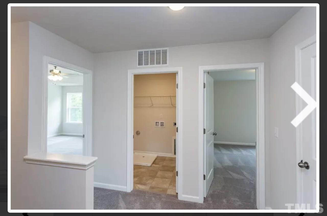 234 Hopper Circle Clayton, NC 27520 - Photo 13 of 22 a view of a bathroom from a hallway