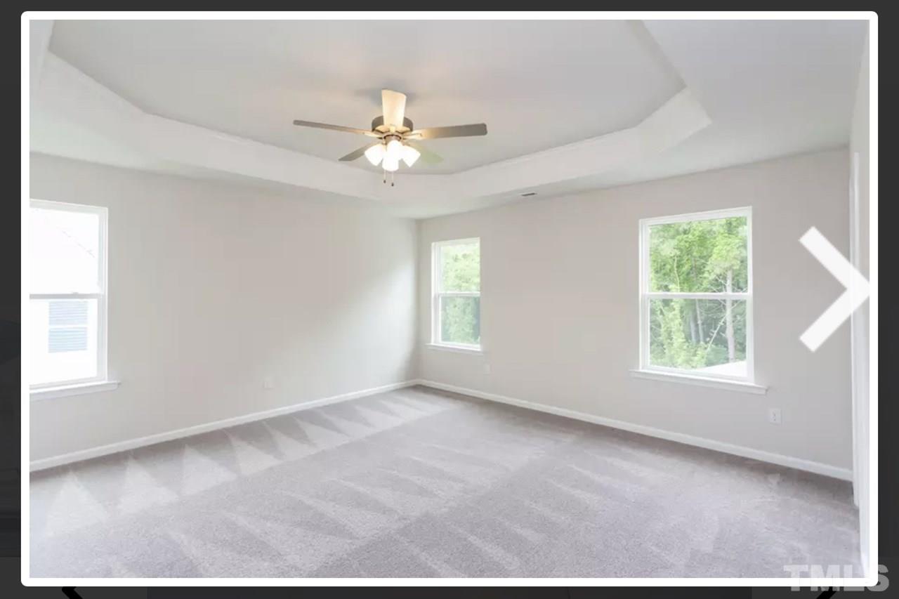 234 Hopper Circle Clayton, NC 27520 - Photo 14 of 22 a view of an empty room with a window