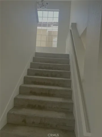 a view of hallway with windows