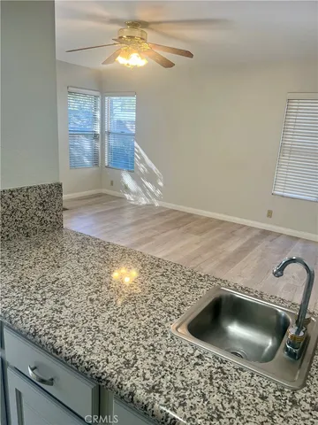 a kitchen with granite countertop cabinets and sink